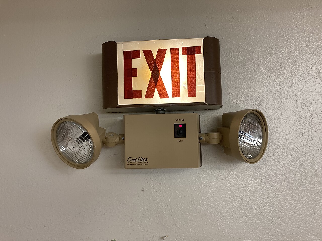 Sure-Lites combination EXIT sign and emergency lighting unit with test button and charge indicator